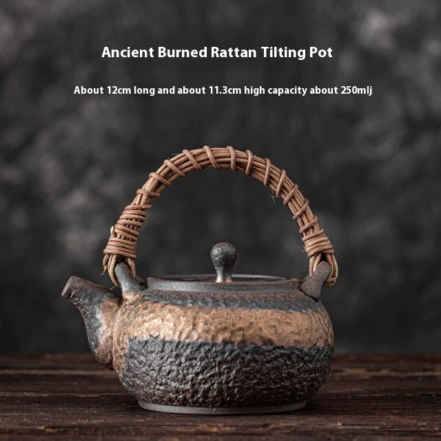 Coarse pottery teapot with gilded handle